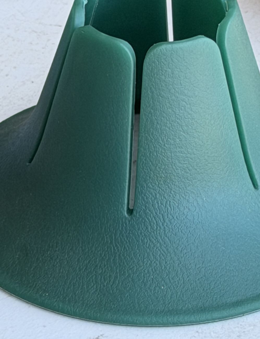 A close macro of a teal Steadi from above: the six fins and the flared base are one continuous moulded surface.